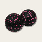 Balle de massage dos noire avec motifs roses