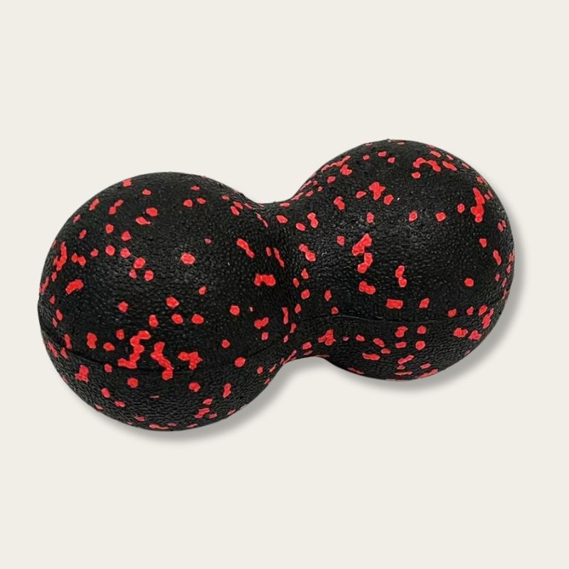 Balle de massage dos noire avec éclats rouges 