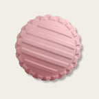 Boule de massage rose à texture marquée vue du dessus