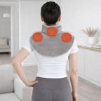 Coussin massant chauffant porté sur la nuque et les épaules, avec diffusion de chaleur ciblée