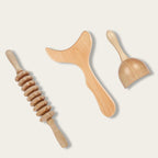 Kit maderotherapie en bois naturel avec rouleau, ventouse et spatule sur fond neutre
